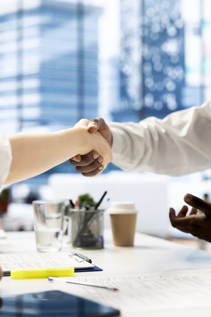 hr professional shaking hand with candidate for vacant startup business position
